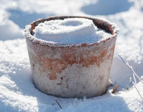 Flowerpot with Snow and Frost Stock Photos