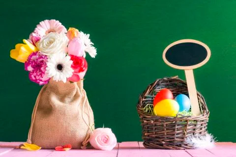 Flowers and Easter eggs with a banner Stock Photos