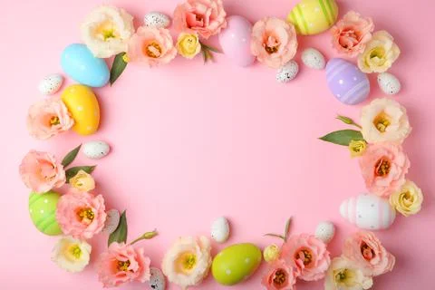 Flowers and Easter eggs on a colored background close-up. Easter background Stock Photos