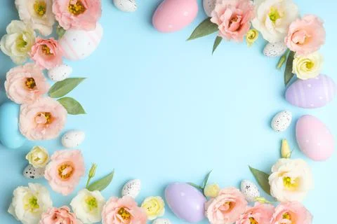 Flowers and Easter eggs on a colored background close-up. Easter background Stock Photos