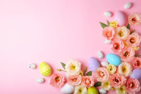 Flowers and Easter eggs on a colored background close-up. Easter background Stock Photos