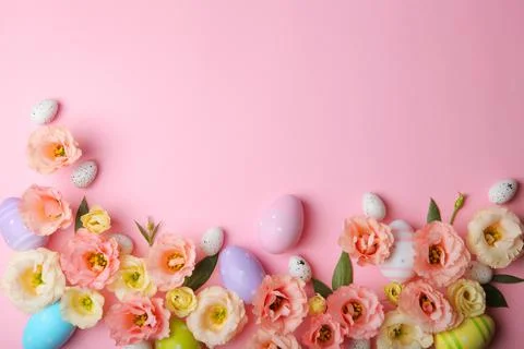 Flowers and Easter eggs on a colored background close-up. Easter background Stock Photos