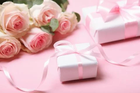 Flowers and gifts on the table. March 8 concept, mother's day, womens day Stock Photos