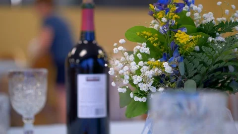 Flowers and wine at a dinner table 動画素材 93262056