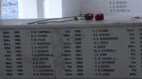 Flowers Around Wall Of Names At USS Arizona Memorial, Pearl Harbor, Hawaii Stock Footage 154495909