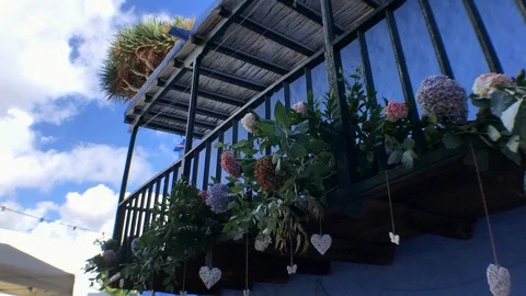 FLOWERS ON THE BALCONY Stock Footage 102106785