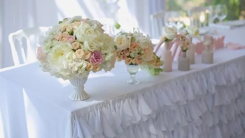 Flowers compositions on table Stock Footage 73139610