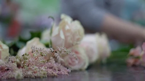 Flowers on the desktop of a florist. The process of making a bouquet in a flower Stock Footage 123652737