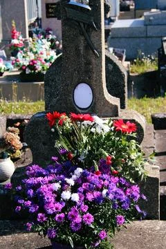 Flowers on the grave Stock Photos