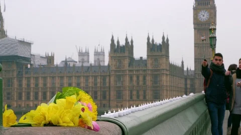 FLOWERS LEFT IN MEMORY OF WESTMINSTER BRIDGE Stock Footage 80536827