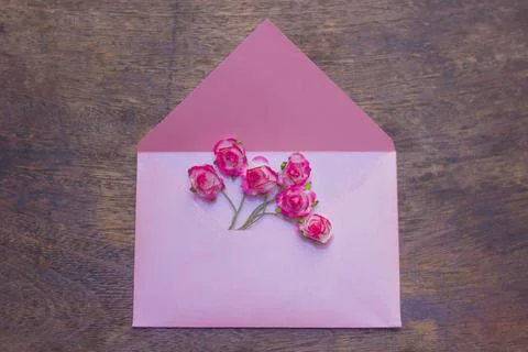 Flowers in a light pink envelope Stock Photos