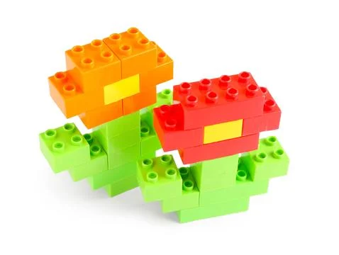 Flowers made of plastic building blocks on white background Stock Photos