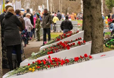 Flowers on the monuments. Stock Photos