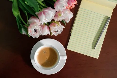 Flowers notepad and coffee on the table. valentine's day concept 스톡 사진