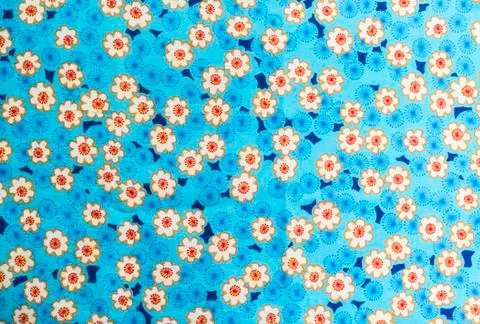 Flowers pattern on fabric background Stock Photos