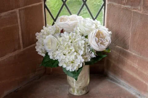 Flowers set in a chruch window Stock Photos