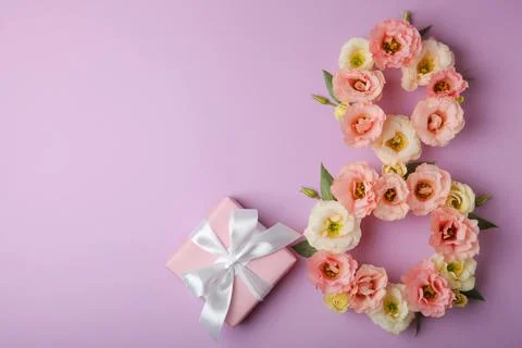 Flowers in the shape of number 8 on a colored background with place for text Stock Photos