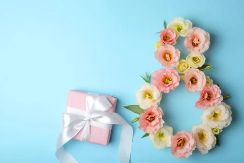 Flowers in the shape of number 8 on a colored background with place for text Stock Photos