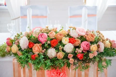Flowers on the table in bright hall Stock Photos