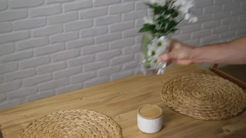 The flowers in the vase were placed on the table. Fresh cut flowers for home dec Stock Footage 147310286
