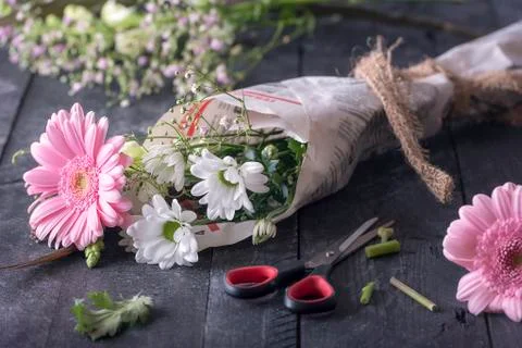 Flowers wrapped in newspaper Stock Photos