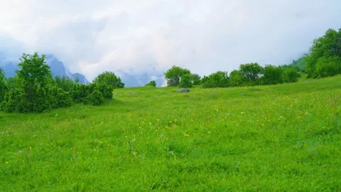 Flowery meadows and cloud-shrouded valleys Stock Footage 314635798