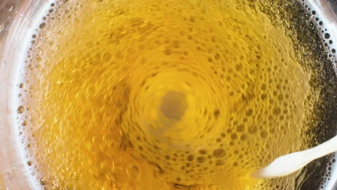 Flowing beer with bubbles Stock Footage 134700578
