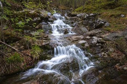 Flowing cascade water Stock Photos