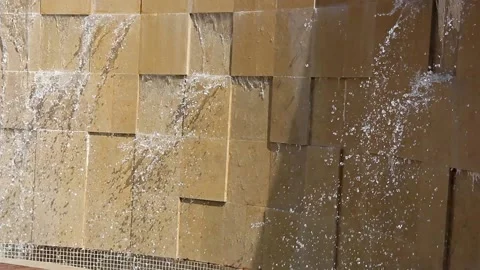 A flowing cascading waterfall on a wild stone wall Stock Footage 160951358