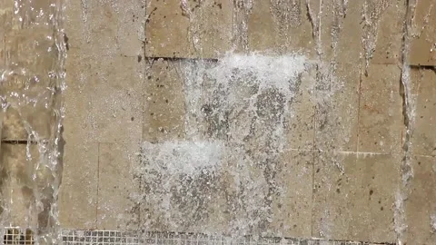 A flowing cascading waterfall on a wild stone wall Stock Footage 160951377