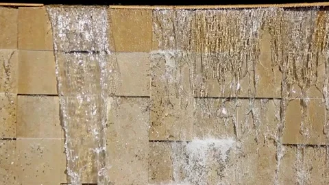 A flowing cascading waterfall on a wild stone wall Stock Footage 160951413