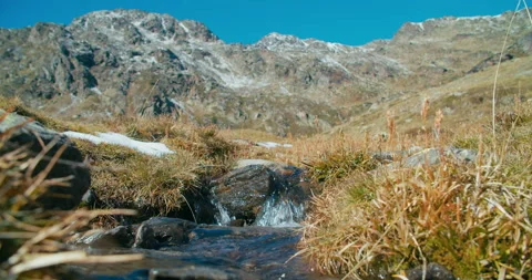 Flowing clean water in mountain river or creek at springtime on epic landscape Stock Footage 219614744