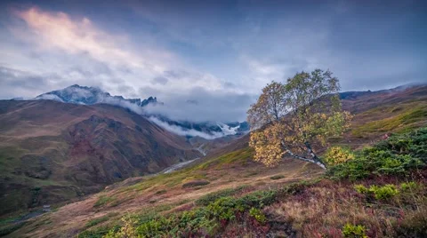 Flowing clouds around Ushba peak Stock Footage 58587322