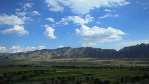 The flowing clouds on the grassland Stock Footage 235106488