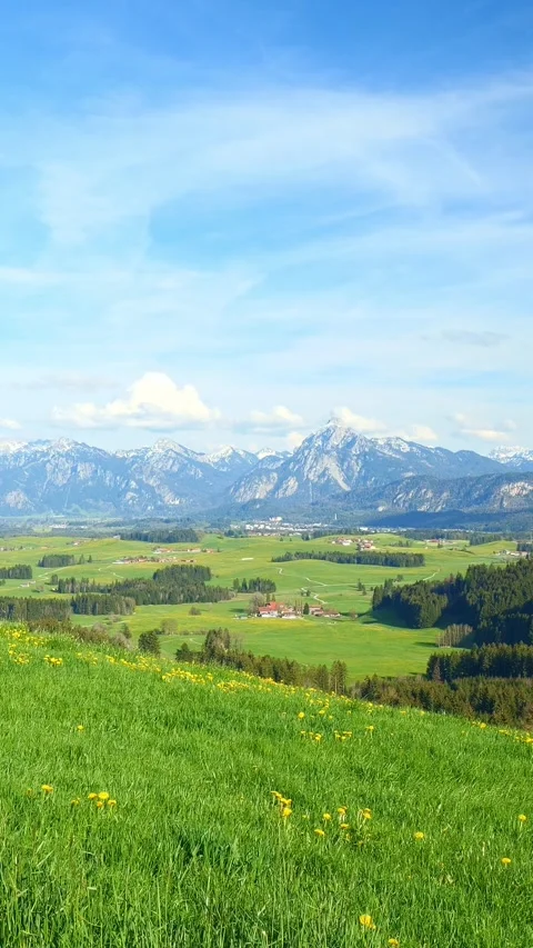 Flowing clouds in motion over the picturesque mountain landscapes, with views Stock Footage 309227829