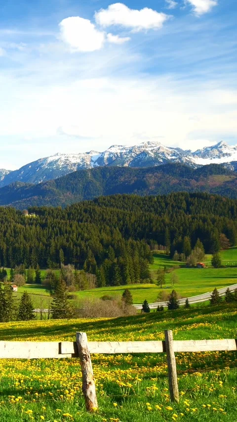 Flowing clouds over distant mountain landscapes in a timelapse, capturing the Stock Footage 309227476