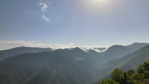 Flowing clouds over green mountains. Stock-Footage 156169048