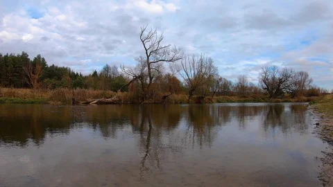  Flowing clouds over the Wieprz River Stock Footage 119766064