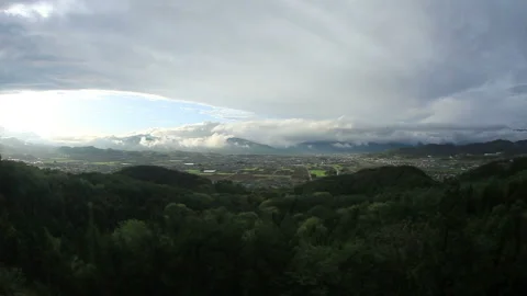Flowing Clouds, Salt Fields, Ueda City, and the Sunset over Jukkan Mountain Stock Footage 330180194