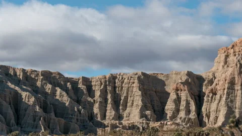 Flowing cloudscape over the unique topography of the cliffs at Red Rock Stock Footage 145742676