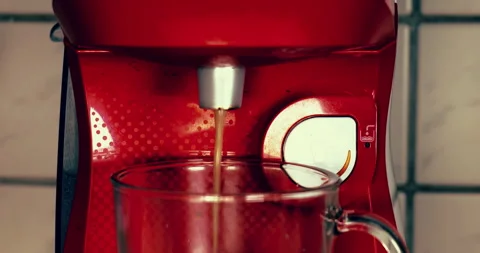 Flowing coffee flowing from a machine. make hot coffee at home. cinematic look Stock Footage 267570500