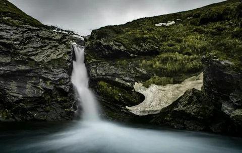 Flowing Forest Stream with Mountain Background Stock Photos