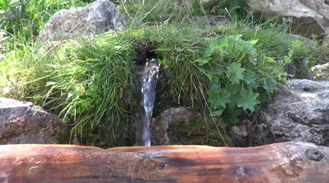 Flowing fresh mountain spring water, drinking water, jet, pipe, spout Stock Footage 35069644
