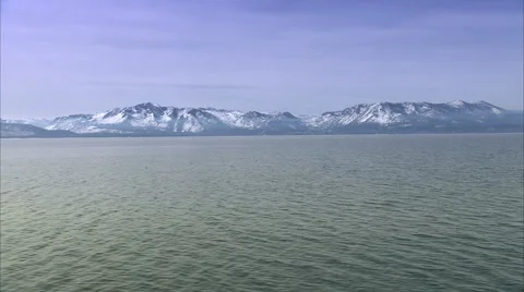 Flowing lake at base of mountain Video stock 986641