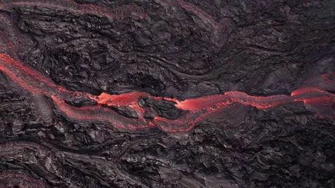 Flowing Lava River on Active Volcano Aerial Drone Flies Up On Hardened Ash Stock Footage 256715109