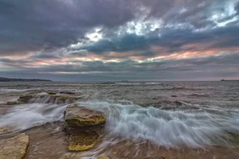Flowing out at sunset Foto stock
