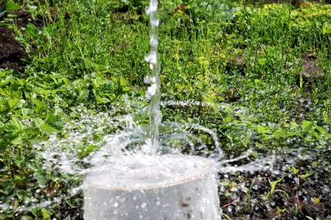 Flowing out of water to surface with splash Stock Photos
