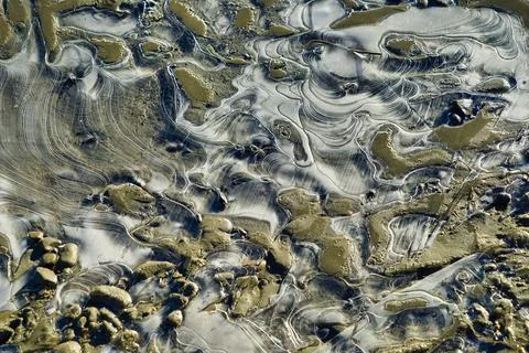 Flowing pattern. River water passes through the stone to form a silky pattern. Stock Photos
