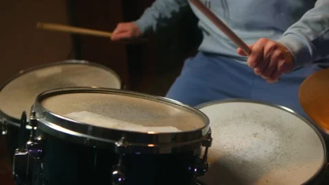 Flowing percussion patterns create soothing atmosphere. Drummer plays with Stock Footage 312845788