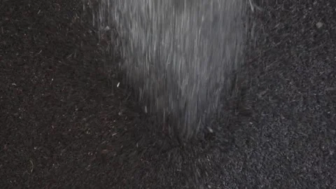 Flowing Powder on Dark Surface Stunning Stock Footage for Visual and Cinematic Stock Footage 310315860